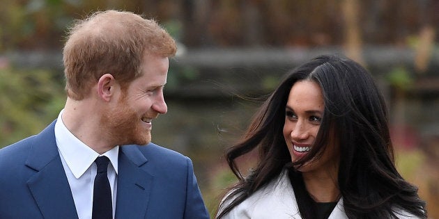 Britain's Prince Harry poses with Meghan Markle in the Sunken Garden of U.K.'s Kensington Palace, November 27, 2017. REUTERS/Toby Melville