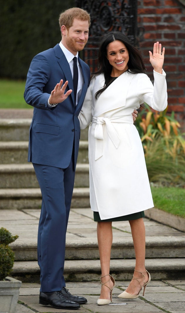 Britain's Prince Harry poses with Meghan Markle in the Sunken Garden of Kensington Palace, London, Britain, Nov. 27, 2017.