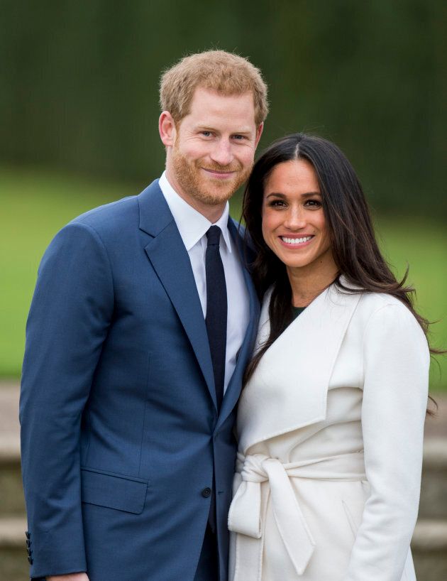 Prince Harry and Meghan Markle pose during an official photocall to announce the engagement of Prince Harry and actress Meghan Markle at The Sunken Gardens at Kensington Palace on Nov. 27, 2017 in London, England.