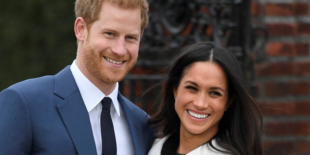 Prince Harry poses with Meghan Markle at Kensington Palace, London, Nov. 27, 2017.