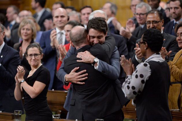 Prime Minister Justin Trudeau hugs Liberal MP Randy Boissonnault in the House on Nov. 28, 2017.