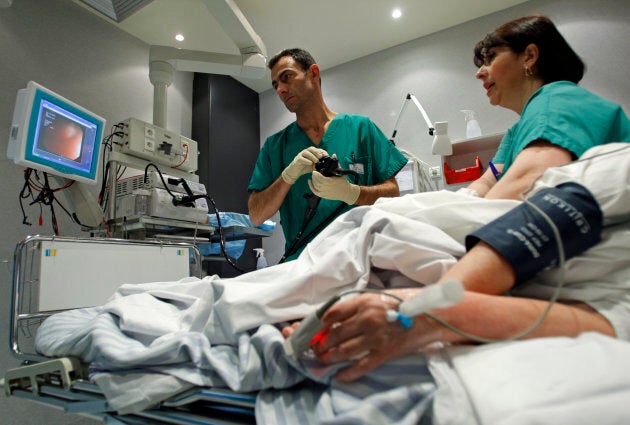 A doctor performs a colonoscopy on a patient at the Ambroise Pare hospital in Marseille, southern France on March 25, 2008.