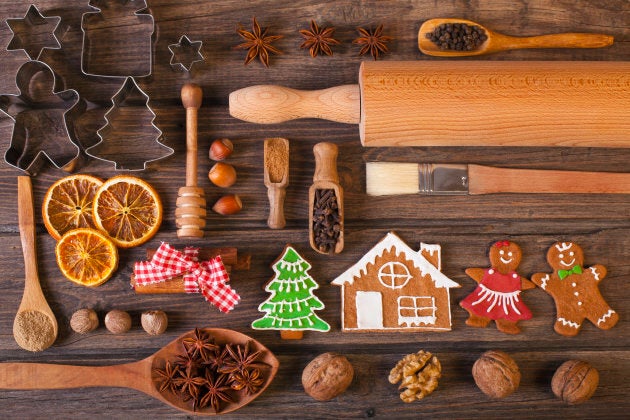 Christmas homemade gingerbread cookies on wood table. Used gingerbread cookies home-handedly made it from me. They are unique pieces and can not be found anywhere.