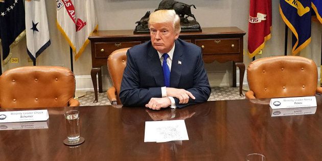 U.S. President Donald Trump at the White House in between two empty chairs for Democratic leaders who decided to skip the meeting after he attacked them on Twitter on Nov. 28.