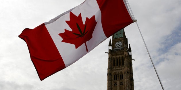 A Canadian flag with a marijuana leaf on it is seen during the annual 4/20 marijuana rally on Parliament Hill in Ottawa on April 20, 2017.