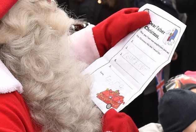 Santa Claus reads Prince George's letter.
