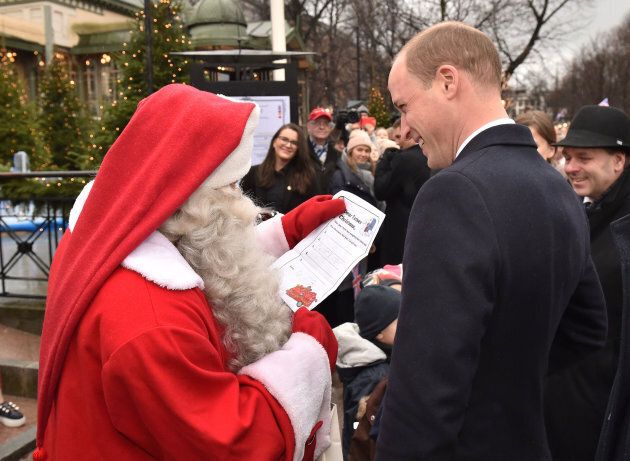 The Duke of Cambridge hands Prince George's Christmas wish list to Santa Claus.