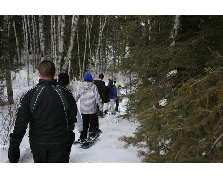 Group of volunteers tracking through the snow (Photo by Josh Dillabough)
