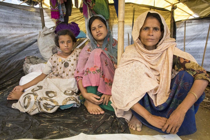 Jaheda, 35, and her daughters Zohara, 10, and Senowara, 18, in their tent.