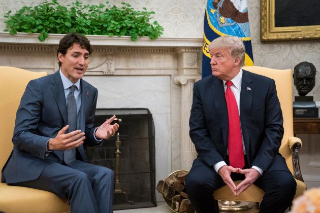 President Donald Trump listens to Prime Minister Justin Trudeau in the Oval Office of the White House on Oct. 11, 2017.