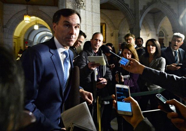 Bill Morneau talks with media in Ottawa on Nov. 28, 2017.