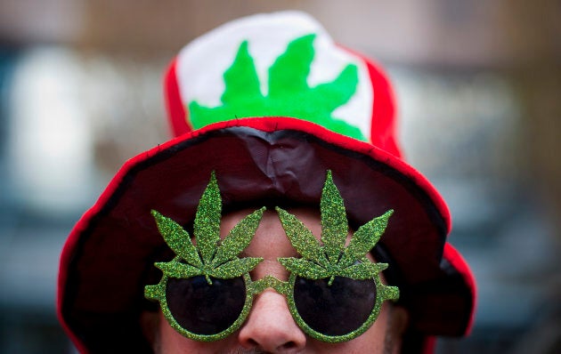 A man, wearing a marijuana-themed hat and sunglasses, is pictured at the Vancouver Art Gallery during the annual 4/20 day, which promotes the use of marijuana, in Vancouver, April 20, 2013.