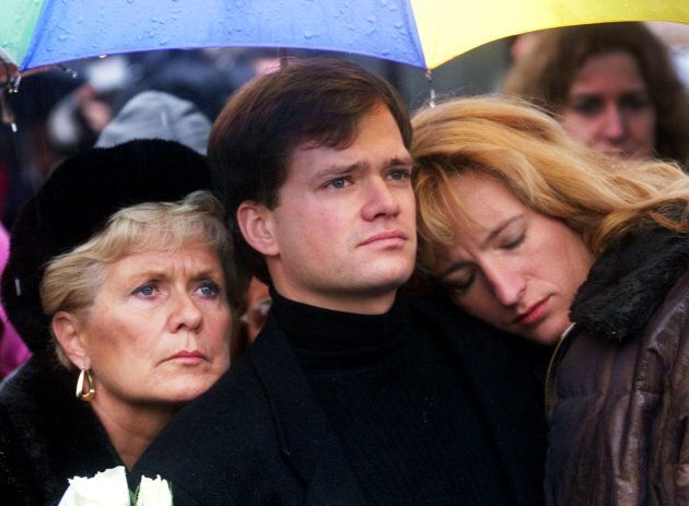 Family members of Montreal Massacre victim Anne-Marie Edward hug during a memorial service in Montreal, on Dec. 5, 1999.
