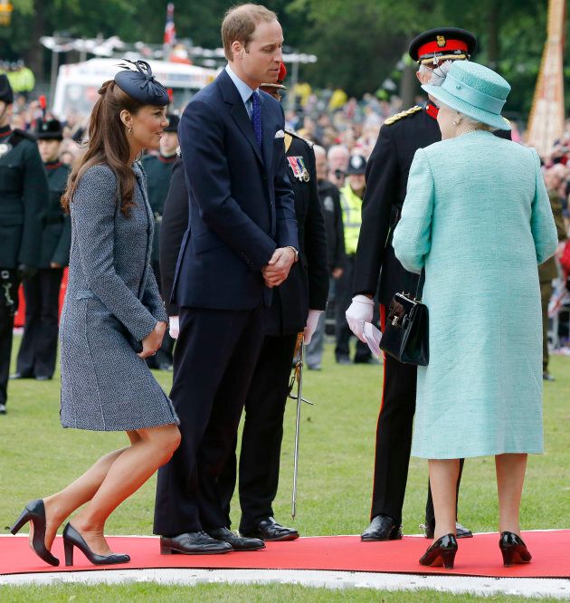 Catherine, Duchess of Cambridge curtsies to Queen Elizabeth.