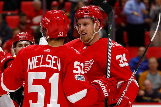 Detroit Red Wings right wing Anthony Mantha (39) receives congratulations from center Frans Nielsen (51) after scoring in the second period against the Calgary Flames at Little Caesars Arena, Nov. 15, 2017 in Detroit.