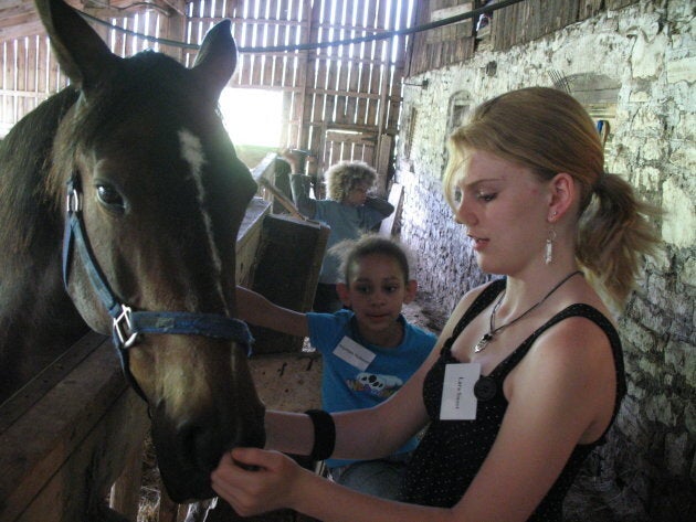 Lara Sweet is shown at a horse farm in 2008.