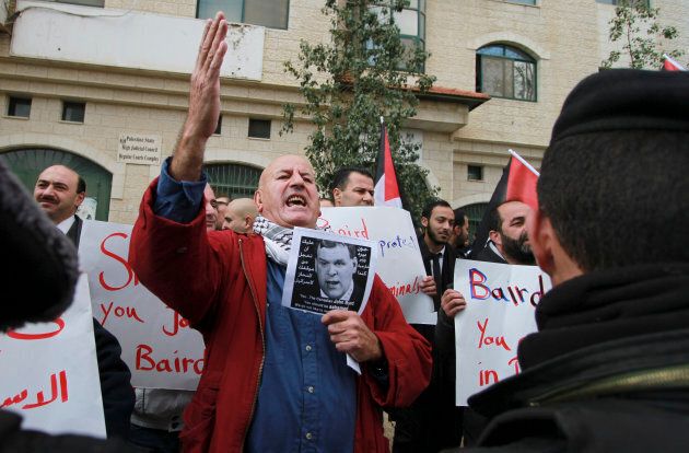 Around a hundred Palestinian protesters heckled and threw eggs at Canadian Foreign Minister John Baird during his visit to the West Bank on Jan. 18, 2015.