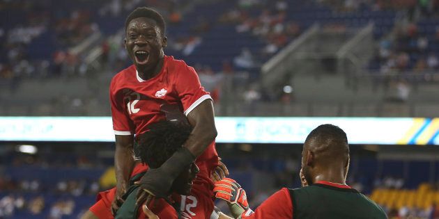 Alphonso Davies celebrates with teammates after scoring during a match between French Guiana and Canada as part of the Gold Cup 2017 on July 7 at Red Bull Arena in New Jersey.