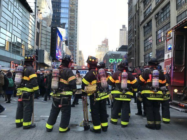 Firefighters gather at the site of a blast in New York City on Dec. 11, 2017.