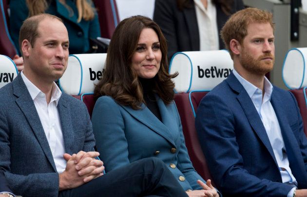 The Duke and Duchess of Cambridge with Prince Harry at the Coach Core graduation ceremony at London Stadium on Oct. 18, 2017.