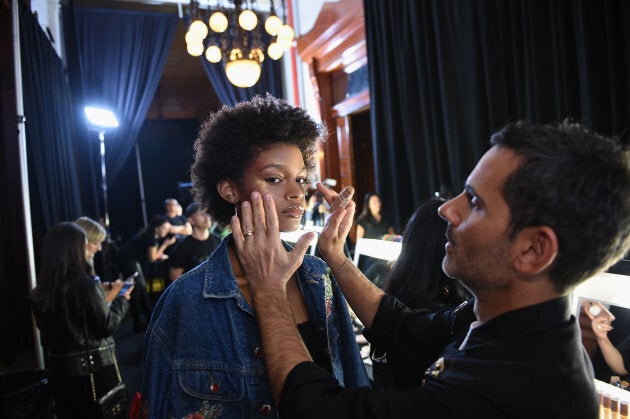 A model has her makeup done with Fenty Beauty products backstage at the FENTY PUMA by Rihanna Spring/Summer 2018 Collection at Park Avenue Armory on Sept. 10, 2017 in New York City.