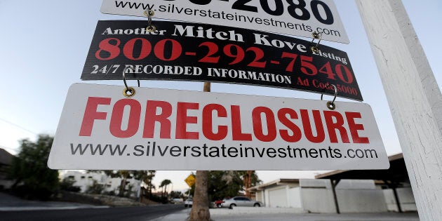 A foreclosure sign is seen in front of a bank-owned home for sale in Las Vegas, Nev., Nov. 8, 2010, in the wake of the city's housing bubble bursting. A new study finds that 40 to 50 per cent of housing booms end in a bust.