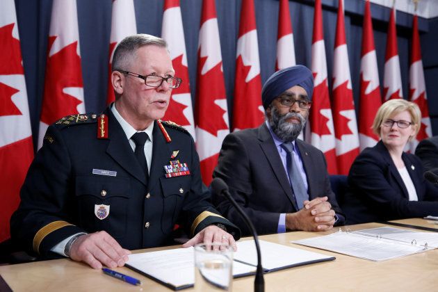 Canada's Chief of the Defence Staff General Jonathan Vance, far left, speaks during a news conference with Defence Minister Harjit Sajjan, centre, and Public Works Minister Carla Qualtrough in Ottawa on Dec. 12, 2017.