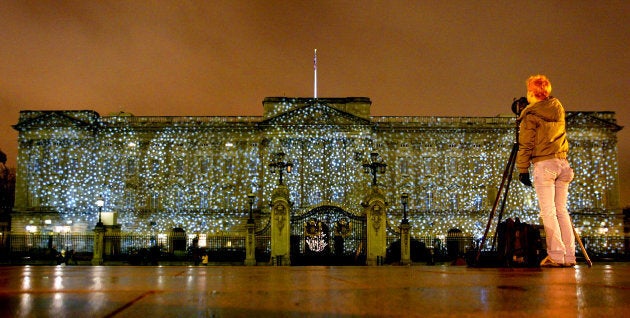 Falling snowflakes is projected onto Buckingham Palace.