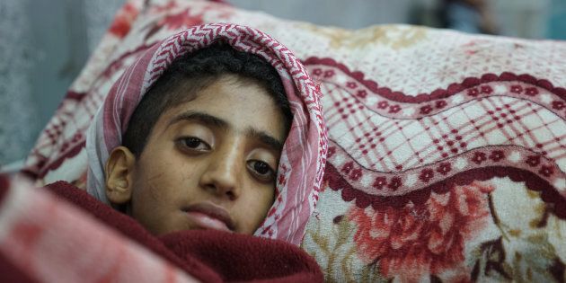 A young boy lies in the emergency room awaiting treatment for suspected cholera at the Al-Joumhouri Hospital, Sana'a, Yemen, on May 3, 2017.