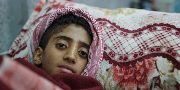 A young boy lies in the emergency room awaiting treatment for suspected cholera at the Al-Joumhouri Hospital, Sana'a, Yemen, on May 3, 2017.