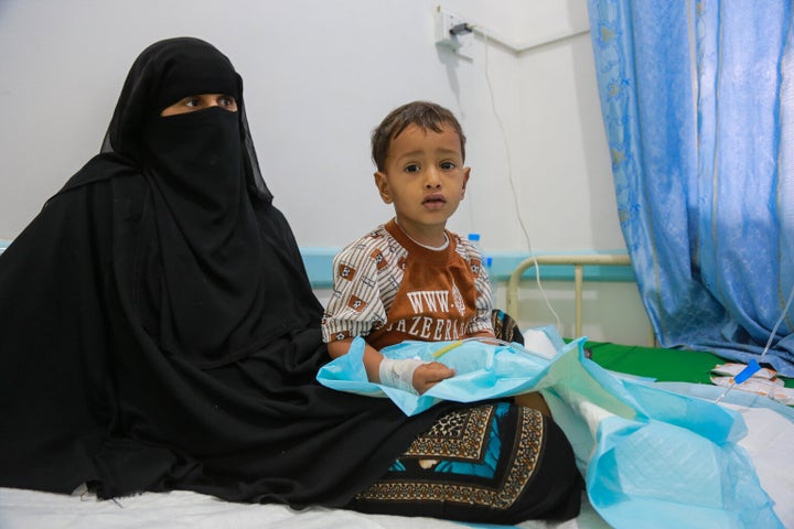 A mother sits with her child, who is being treated for malnutrition, during a visit by UNICEF Executive Director Anthony Lake to the Alsabeen Hospital in Sanaa, Yemen, on July 25, 2017.