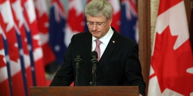 Canadian Prime Minister Stephen Harper pauses as he address the media alongside Australian Prime Minister Tony Abbott(not shown) on Parliament Hill in Ottawa, Canda, June 9, 2014. AFP PHOTO/ Cole BURSTON (Photo credit should read Cole Burston/AFP/Getty Images)