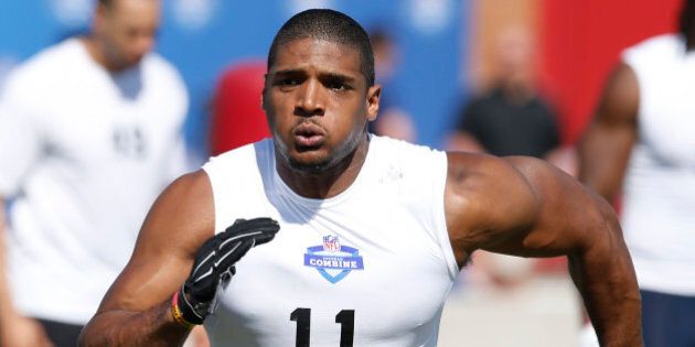 FILE - In this March 22, 2015, file photo, Michael Sam runs through a drill during the NFL Super Regional Combine football workout in Tempe, Ariz. The Montreal Alouettes have signed defensive end Michael Sam, the first openly gay player drafted in the NFL. The club says the free agent has agreed to a two-year deal. (AP Photo/Rick Scuteri, File)