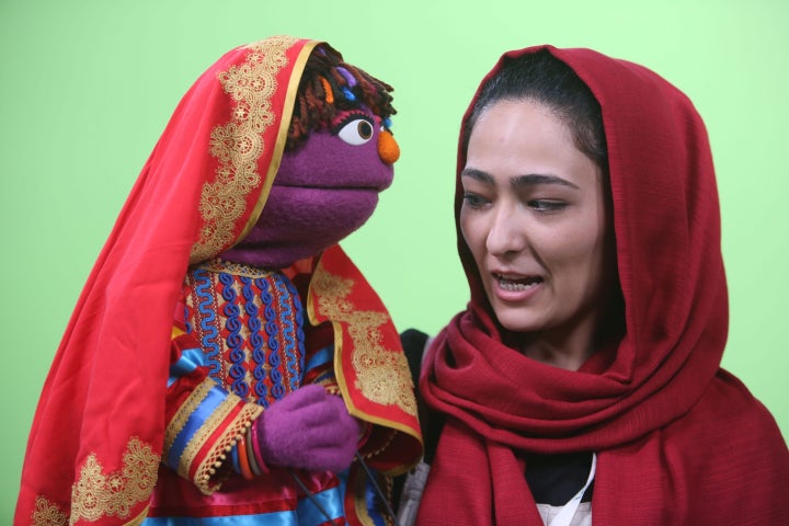 Afghan puppeteer Mansoora Shirzad, right, with Sesame Street's new character, a 6-year-old Afghan girl called Zari, in Kabul, Afghanistan.