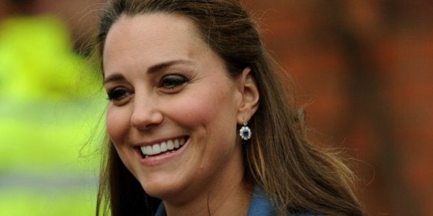 Britain's Kate, Duchess of Cambridge during a visit to Emma Bridgewater factory in Stoke on Trent, England, to see production of a mug,Wednesday Feb. 18 2015. Emma Bridgewater factory has launched a mug to be sold in support of East Anglia's Children's Hospices. (AP Photo/Rui Vieira)