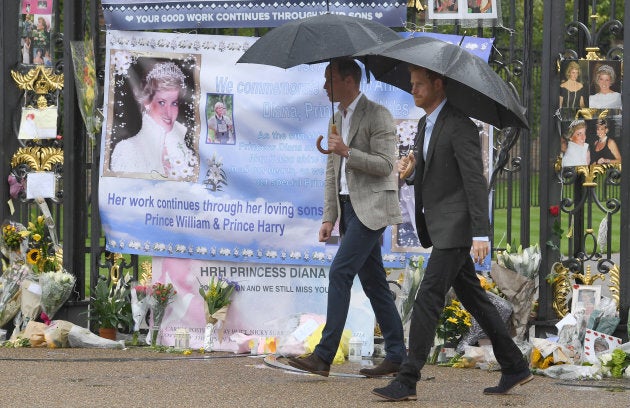 Prince William and Prince Harry view tributes to their mother Princess Diana following a visit to The White Garden in Kensington Palace.