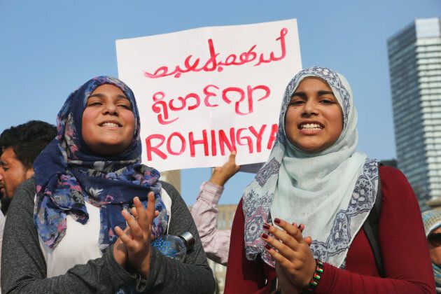 Muslim girls chant slogans of support for the Rohingya Muslims as hundreds of demonstrators marched to protest against the violence against Rohingyas in Myanmar in Toronto on Sept. 16, 2017.