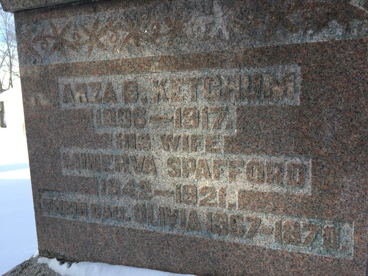 The gravestone of the house's first inhabitants, Azra Ketchum and Minerva Spafford, and their daughter Olivia.