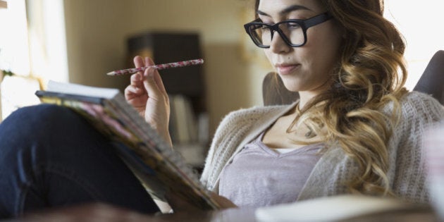 Woman writing in notebook