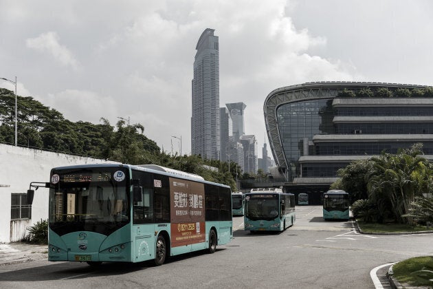 BYD Co. electric buses drive out of a public transportation hub in Shenzhen, China, on Sept. 20, 2017.