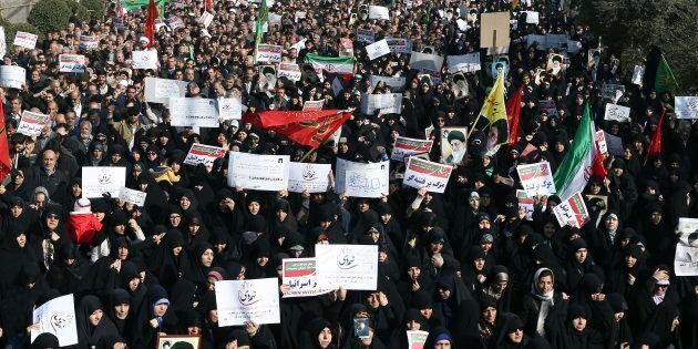 In this Dec. 30, 2017, photo, Iranian protesters chant slogans at a rally in Tehran, Iran.