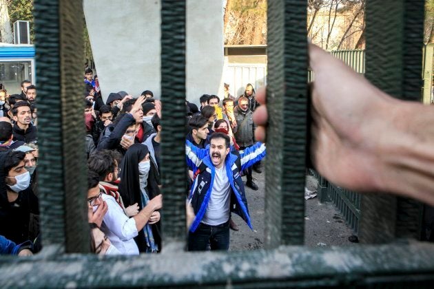 In this Saturday, Dec. 30, 2017 photo, by an individual not employed by the Associated Press and obtained by the AP outside Iran, university students attend an anti-government protest inside Tehran University, in Tehran.