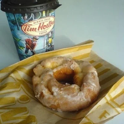 Tim Hortons Has A New Oreo Dream Donut That's Topped With Vanilla Icing And  Cookie Pieces