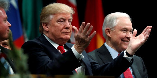 U.S. President Donald Trump is seated with Attorney-General Jeff Sessions at the FBI Academy in Quantico, Virginia, U.S. Dec. 15, 2017. Sessions is reportedly planning to rescind a marijuana-friendly policy from the Obama era.