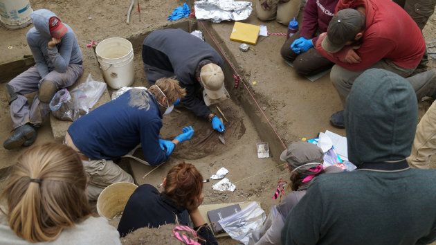 Scientists work on the excavation site of the 11,500-year-old remains of two infant girls at the Upward Sun River in Alaska's Tanana River Valley about 50 miles (80 km) southeast of Fairbanks, Alaska, U.S, in an undated photo released Jan. 3, 2018.
