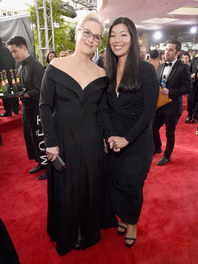 Meryl Streep and activist Ai-jen Poo at the Golden Globe Awards on Jan. 7.