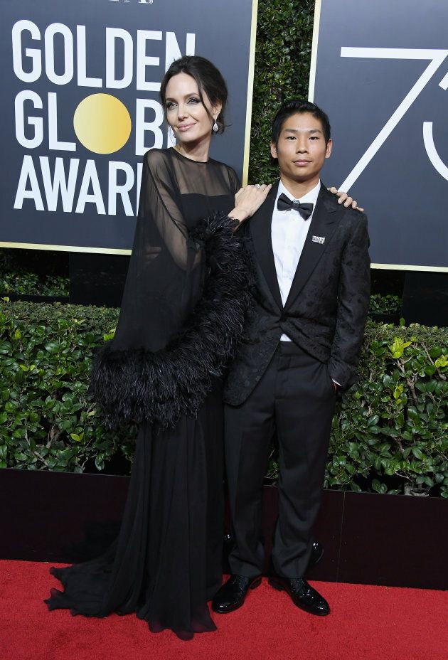Angelina Jolie and Pax Jolie-Pitt attend the Golden Globe Awards on Jan. 7, 2018.