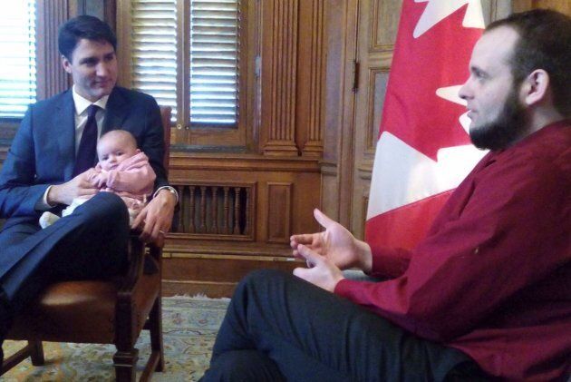 Prime Minister Justin Trudeau, Joshua Boyle, and Boyle's child are shown in a photo posted by a Twitter account named The Boyle Family on Dec. 19.