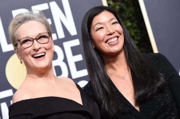 Meryl Streep and Ai-jen Poo, the head of the National Domestic Workers Alliance, at the 75th Golden Globe Awards on Jan. 7.