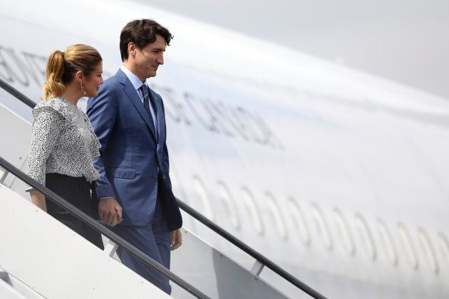Prime Minister Justin Trudeau, right, and his wife, Sophie Gregoire Trudeau, exit a plane on Oct. 12, 2017.